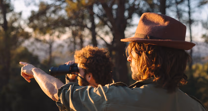Bird watchers with binoculars in the Ramble