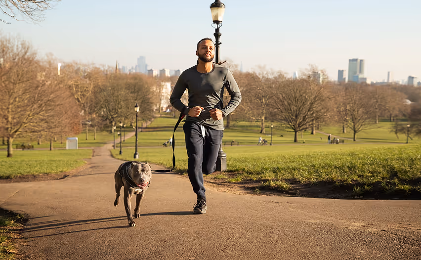 Man jogging with dog